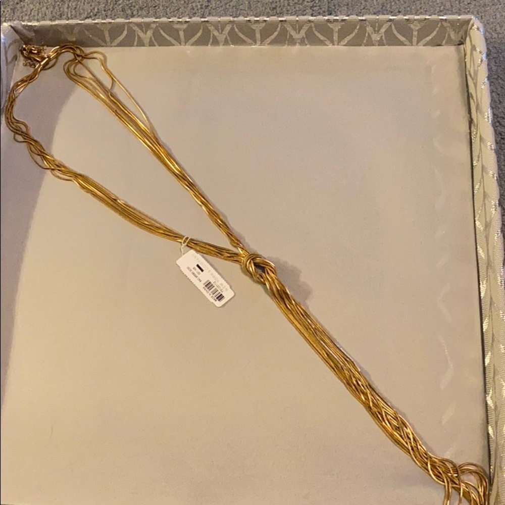 Long gold knotted necklace
